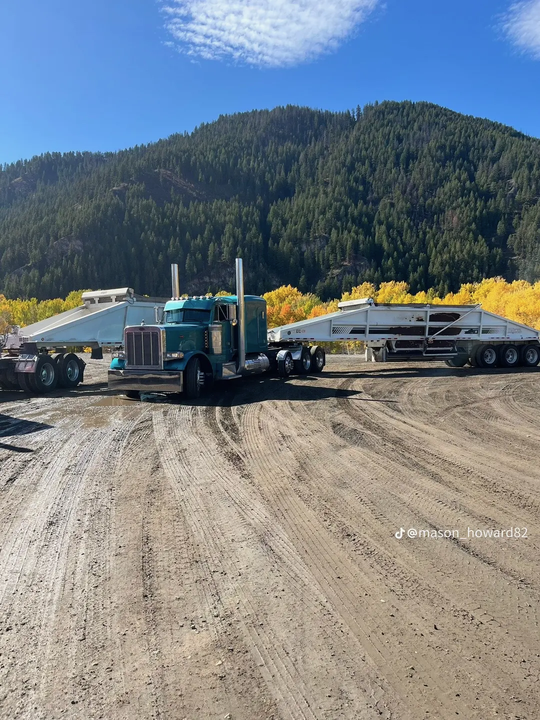 Teal Peterbilt double side dumps